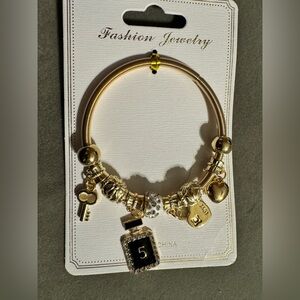 Fashion jewelry, gold tone, rhinestone, heart, key perfume  stretch bracelet